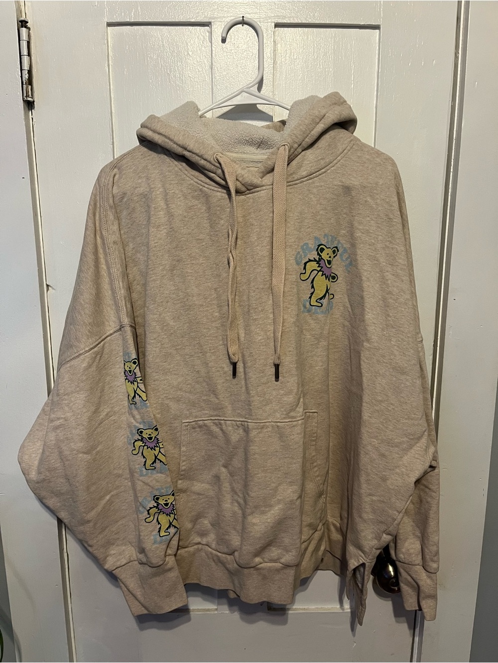American Eagle Outfitters Beige Hoodie with Yellow Bear Graphics